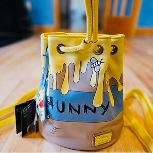 Loungefly Winnie the Pooh 95th Anniversary Honey Pot convertible backpack/purse.